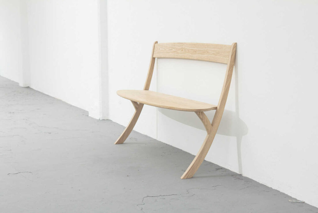 The Leaning Bench dares to question existing forms, proving that sometimes two legs will do just fine. It’s all down to balance. By simply leaning the bench back against the wall elegantly, the design creates sufficient stability, while playfully challenging gravity. The result is a surprising and engaging object with a fluid simplicity, uncluttered by extra supports. Less really is more in this case.

 