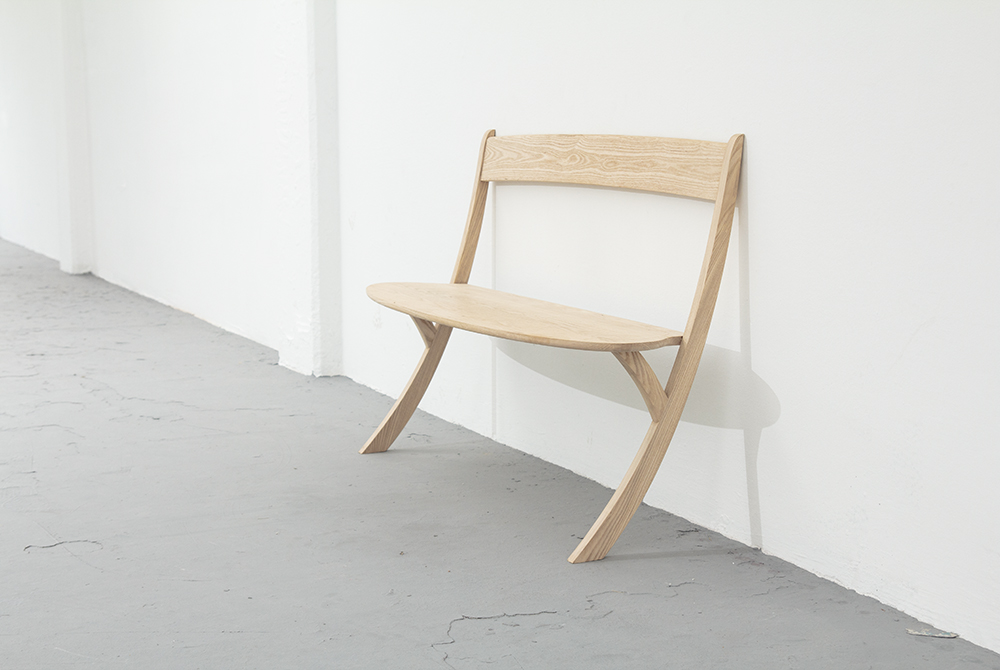 The Leaning Bench is a wooden bench designed to rest against a wall. The seating dares to question existing forms, proving that sometimes two legs will do just fine. It’s all down to balance. By simply leaning the bench back against the wall elegantly, the design creates sufficient stability, while playfully challenging gravity.

 

The result is a surprising and engaging object with a fluid simplicity, uncluttered by extra supports. Less really is more in this case. Rubber underneath the legs prevents slipping, making this ash bench suitable for any kind of floor. The bench is big enough to seat two people.